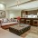 Luxury Apartments in Dallas, TX - The Statler - a living room with couches, table, and wood flooring