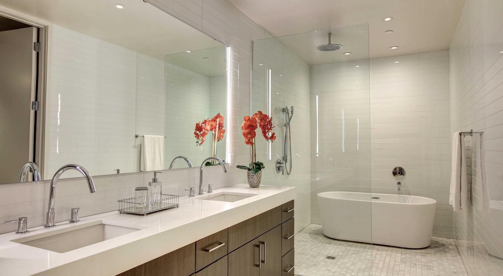 Bathroom options with thoughtful details a bathroom with a tub sink and flowers