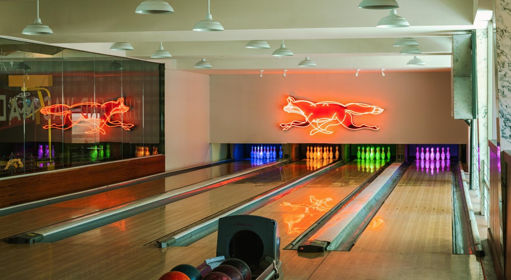 The essence of exceptional living a bowling alley with bowling balls