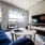 picture windows brighten living room and provide views of the city