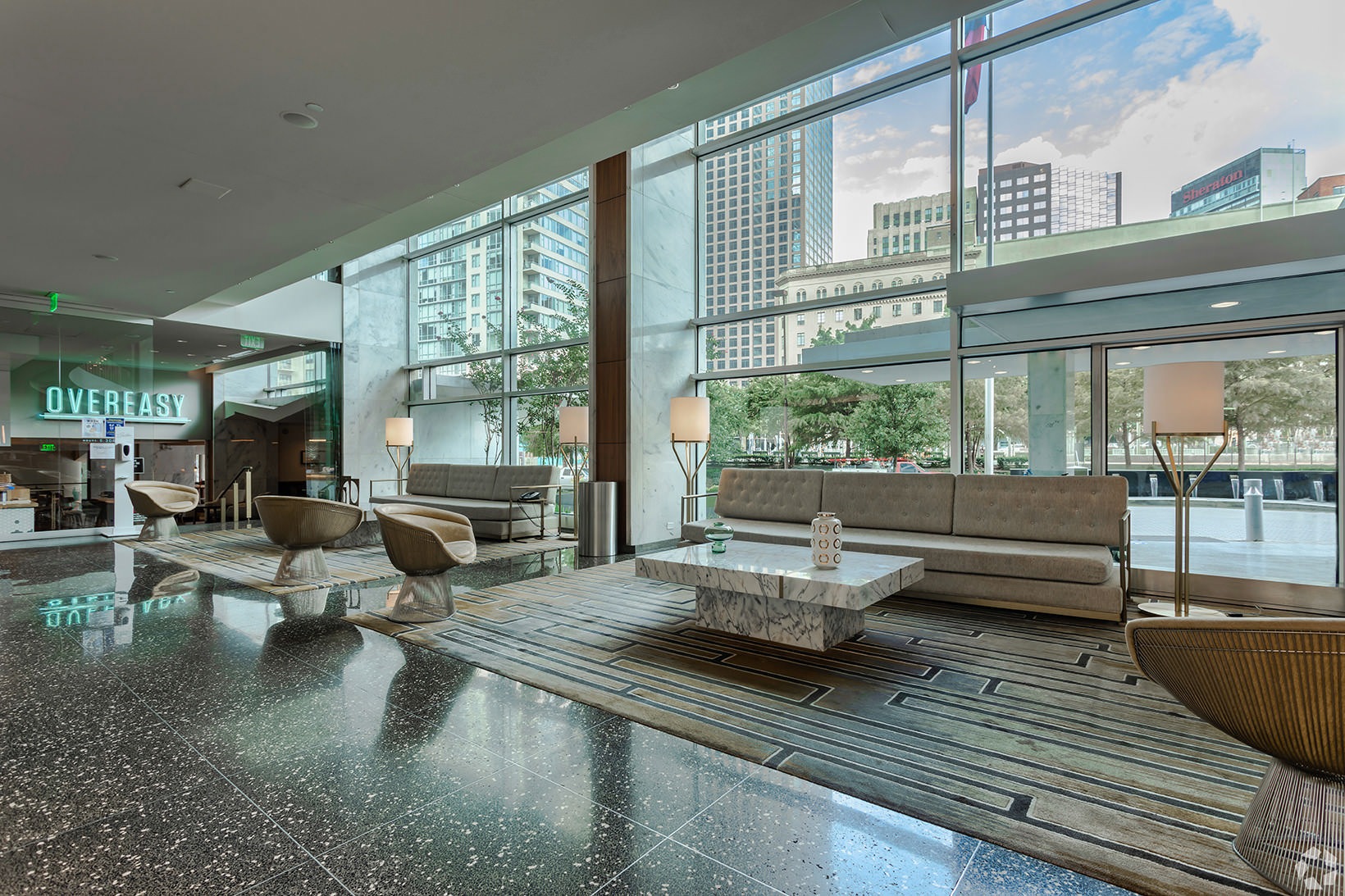 Lobby wall of floor-to-ceiling windows in expansive lobby