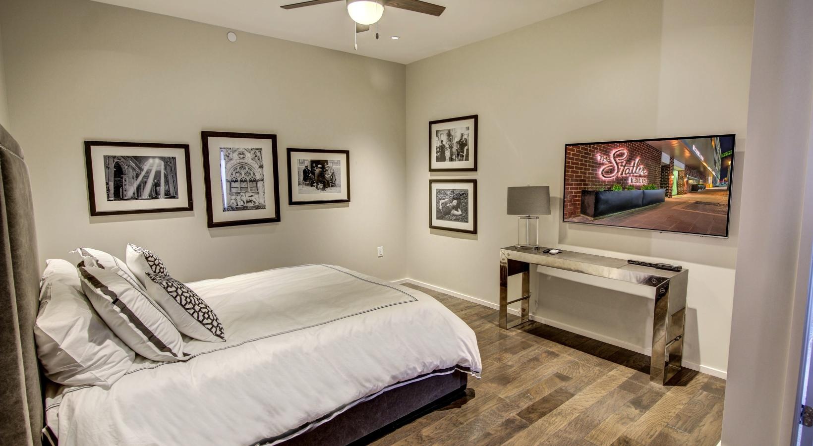 Sleep in style a bedroom with a bed and a fan