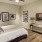 a bedroom with a bed and a fan