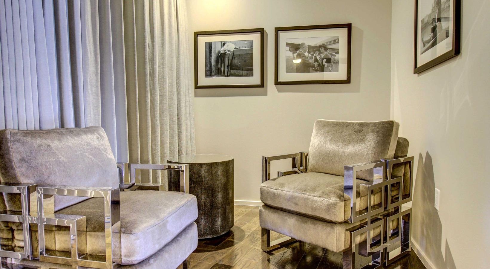 Generous living spaces to relax and unwind a room with chairs and a table