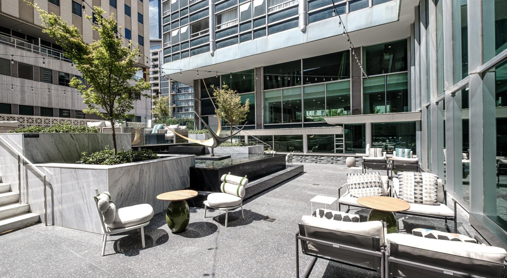 Access to resident-only features a courtyard with tables and chairs