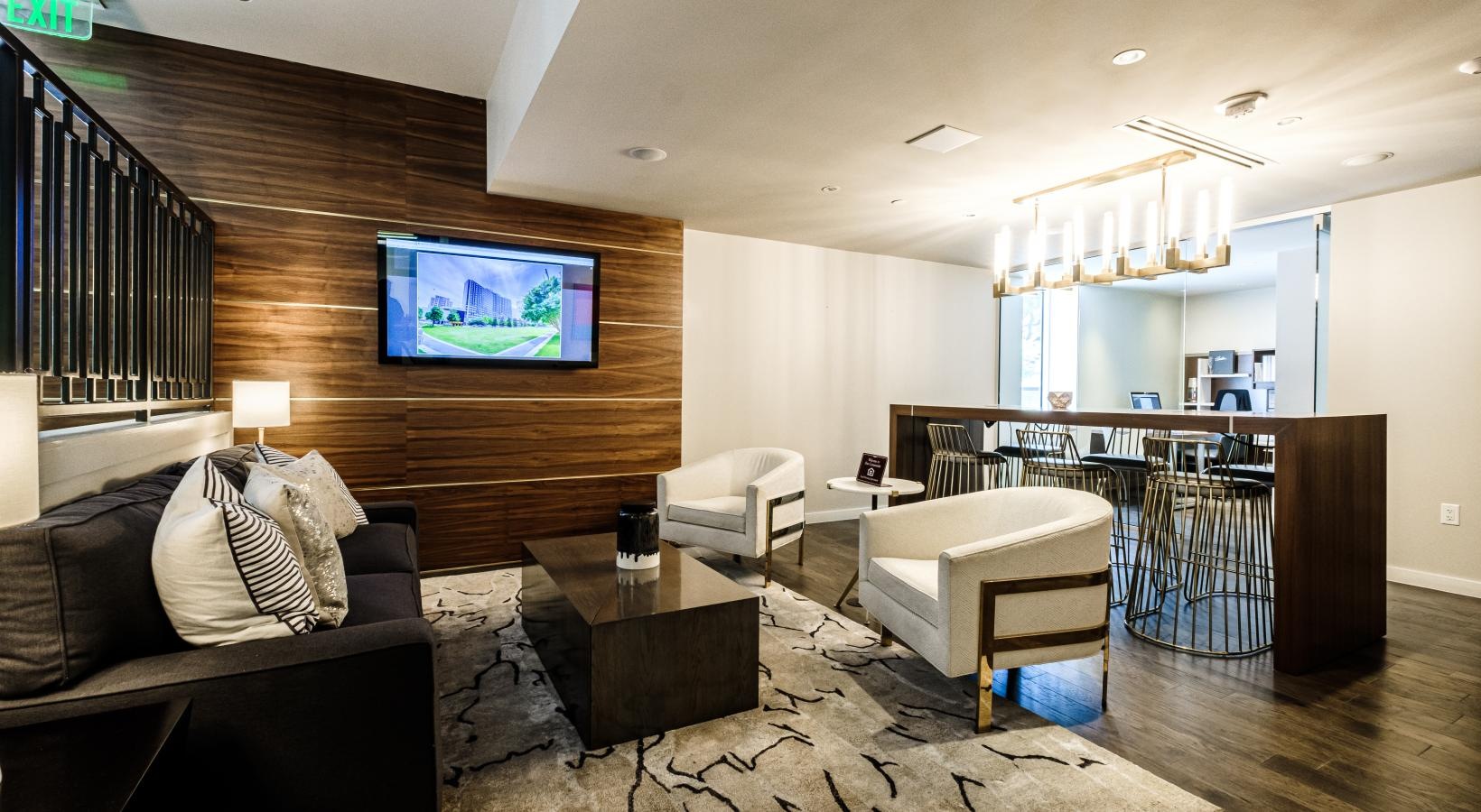 Enjoy our resident-only features a living room with a tv and couches