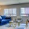 a living room with a blue couch and a table
