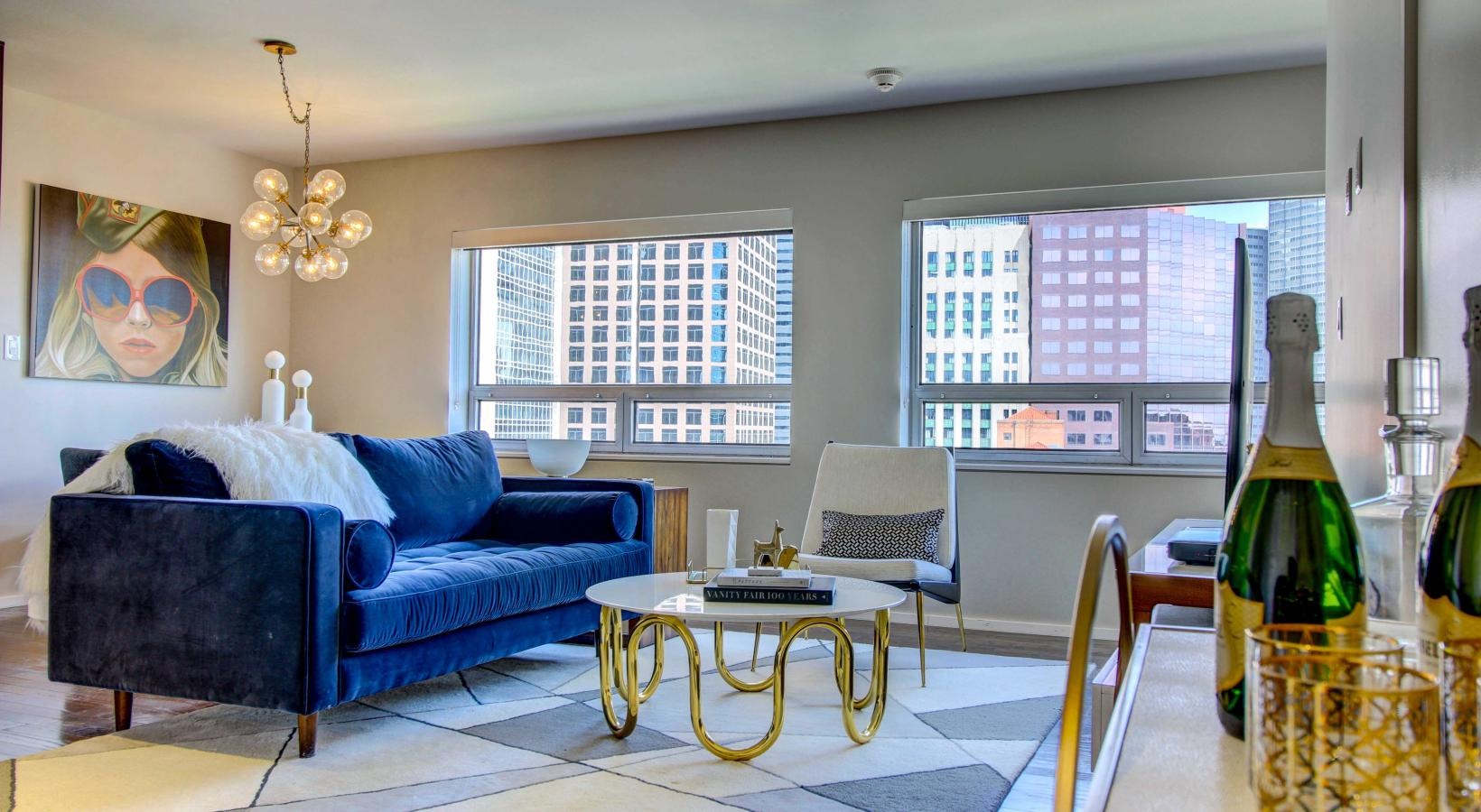 Relax and unwind in stylish living spaces a living room with a blue couch and a table